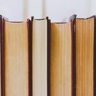 An photograph of upright books, but not their spines—their opposite page sides instead.